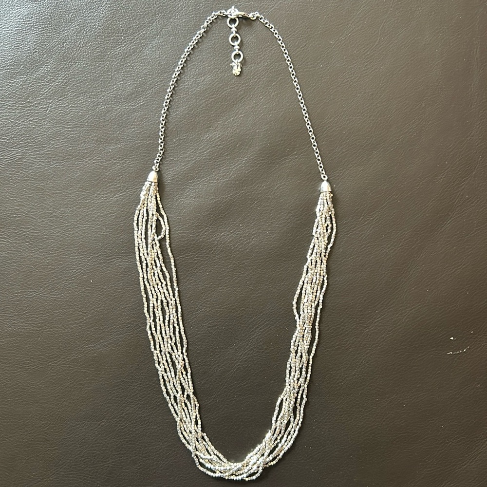 Silver multiple rope chain necklace with tiny cubes. Adjustable clasp.